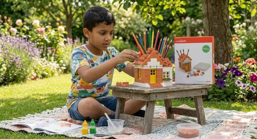 A boy finishing a CAST house outdoors